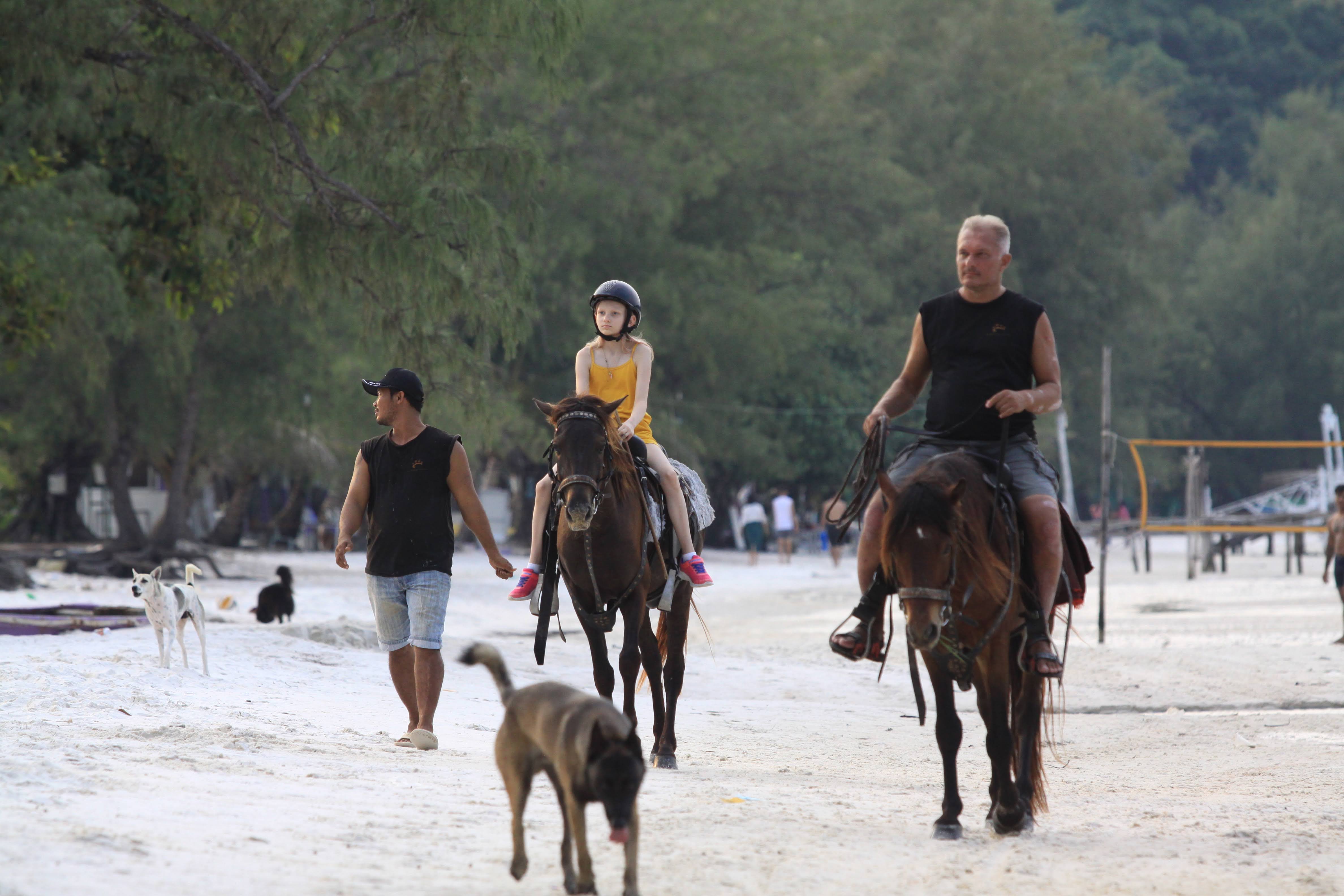 Horseback riding on the beach near Samloem Laguna Resort